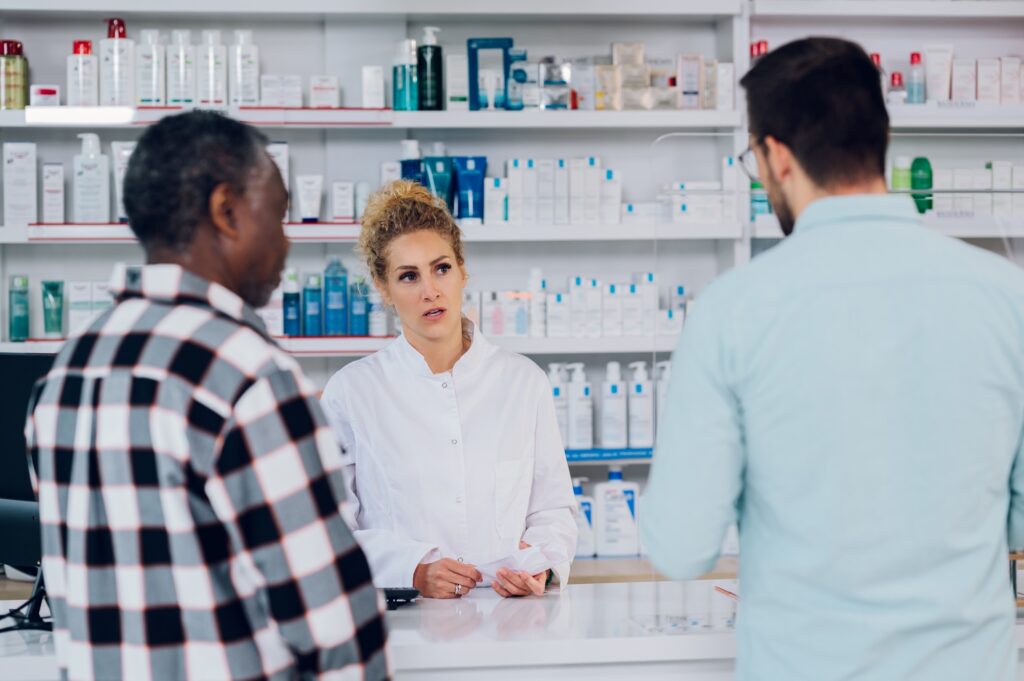 Portrait of woman pharmacist working at the counter in a pharmacy